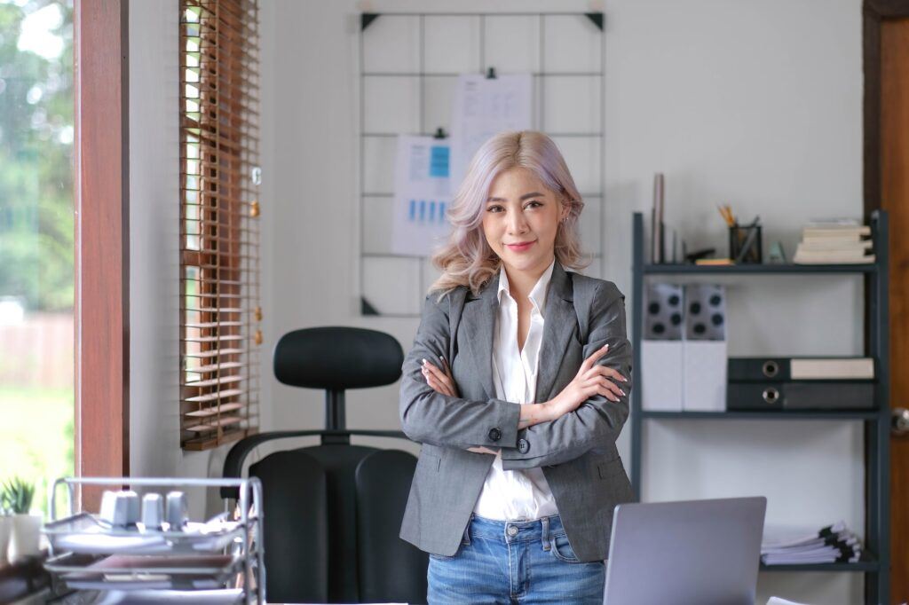 Young confident smiling Asian business woman leader, successful entrepreneur, elegant professional